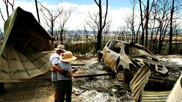 'We would have tried to stay''  . . . Errol and Beverley Shearsby survey the little that is left of their home.