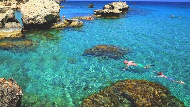 More than perfect: Holiday-makers snorkel at Konnos beach in Cyprus.