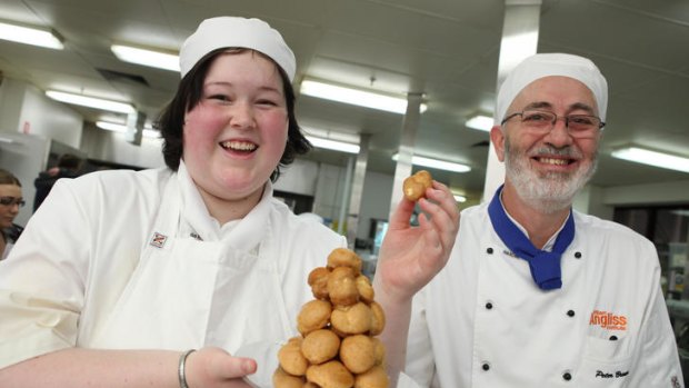 Visitors flocked to see what was cooking at William Angliss open day yesterday. Shae Bright and chef Peter Brown.