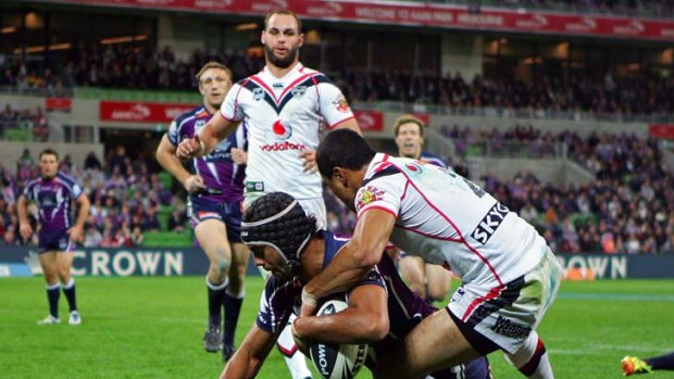 Lining up: Dane Nielsen scores the Storm's first try in the 32-14 win over the Warriors at AAMI Park last night.