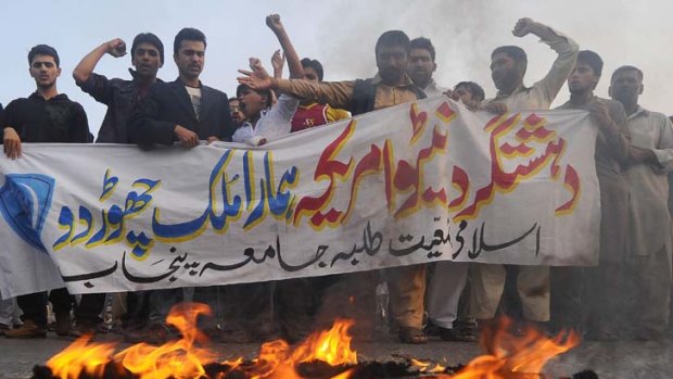 Enraged ... Islami Jamiat Tulba student activists shout slogans against NATO during a protest in Lahore.