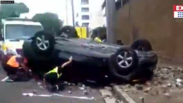 A car crashed through the wall on the second level of Woolworths car park at Eastwood on Thursday.