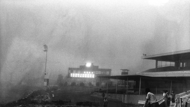 The dust storm hits Moonee Valley Racecourse. The races continued, but few punters remained.