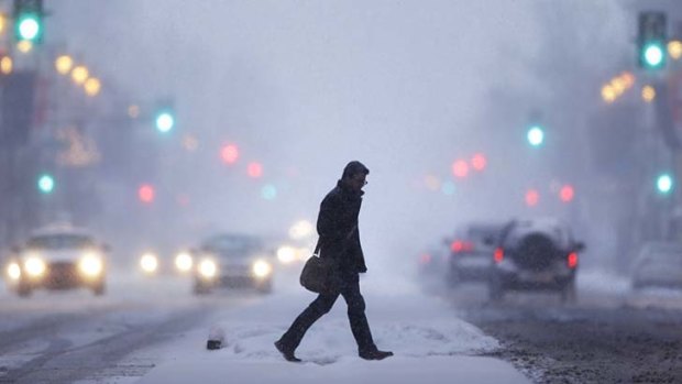 Caught in a blizzard: a man crosses the road in Philadelphia.