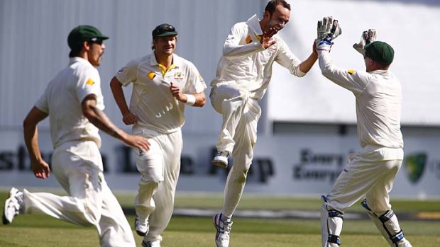 You beauty: Nathan Lyon celebrates on a day when he took 5/50 and his 100th Test wicket.
