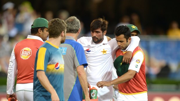 Concern: Mohammad Amir is taken from the field injured.