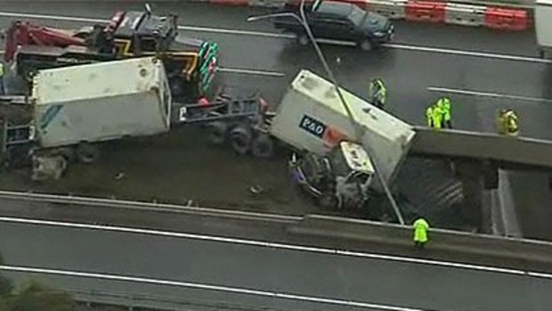 A truck dangles from a Brisbane bridge this morning. Photo: Ten News