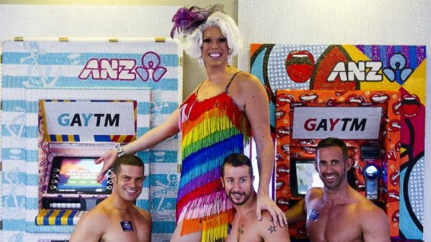 Penny Tration (centre) and friends pose in front of 'GAYTMS' at the ANZ bank in Oxford Street in Darlinghurst.