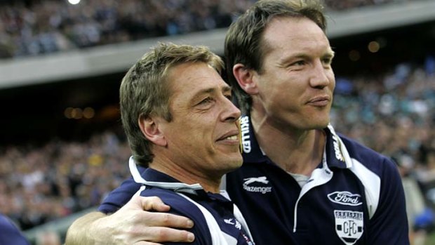 Brenton Sanderson (right) with Mark Thompson after Geelong won the grand final in 2007.