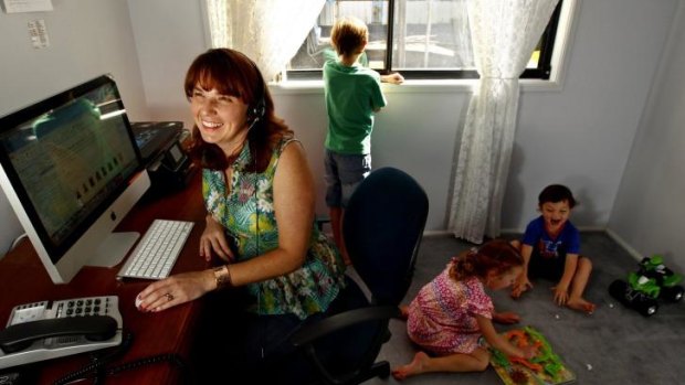 House calls: AAMI staff member Shermaine Fitzgerald in her home office with her children.