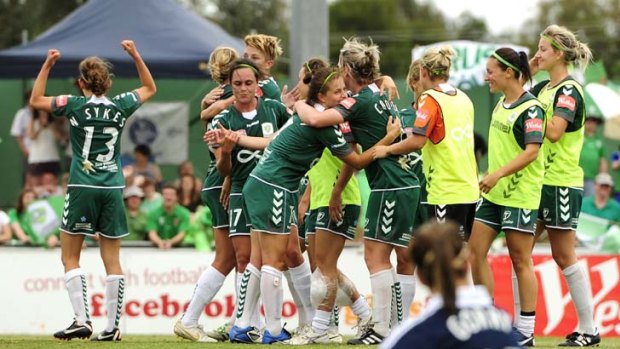 Canberra United celebrate their win over the Victory.