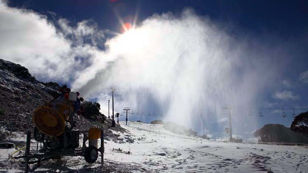 A snow maker at work at Mount Hotham this morning.