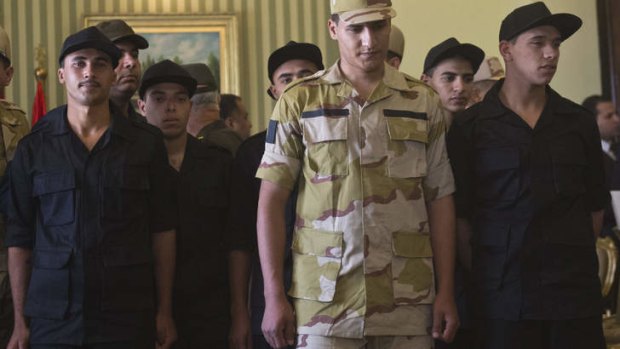 Released: Egyptian police and soldiers who were seized in Sinai by kidnappers arrive in Cairo on Wednesday.
