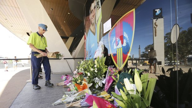 Flowers are amongt the tributes for the late Phillip Hughes outside Adelaide Oval. 