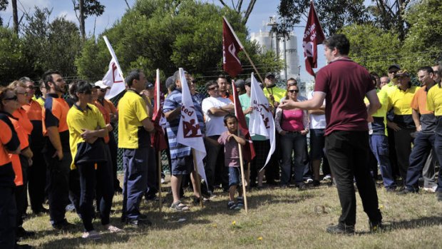 Schweppes workers meet after being locked out of the Tullamarine factory.