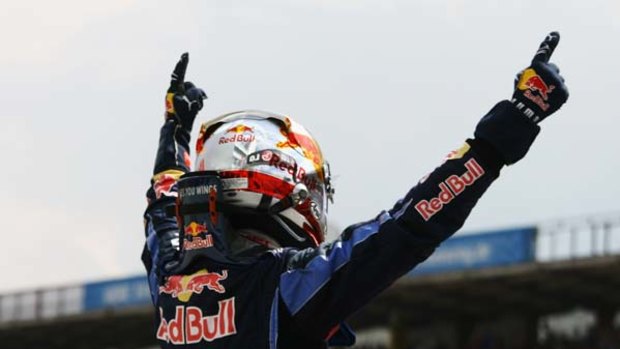 Sebastian Vettel celebrates after finishing first during qualifying.