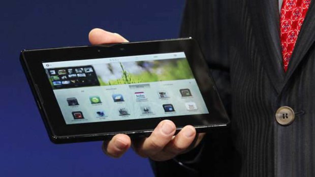 Mike Lazaridis, president and co-CEO of Research in Motion Ltd. (RIM), holds the new PlayBook during the annual BlackBerry developers conference.