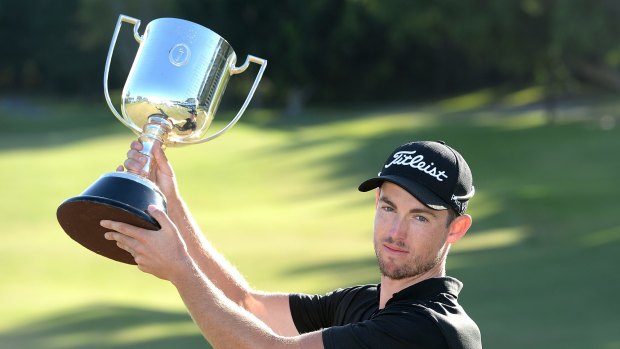 Australian Nathan Holman celebrates his Australian PGA Championship victory with the Kirkwood Cup.