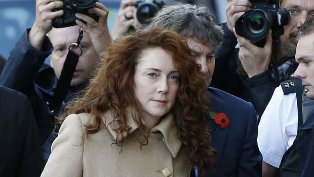 Former newspaper editor Rebekah Brooks is among eight individuals facing charges of hacking phones and bribing officials while at New Corporation's now-closed tabloid News of the World.