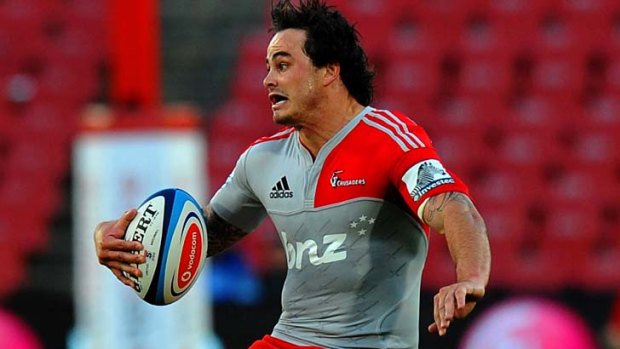 Zac Guildford of the Crusaders avoids a tackle.