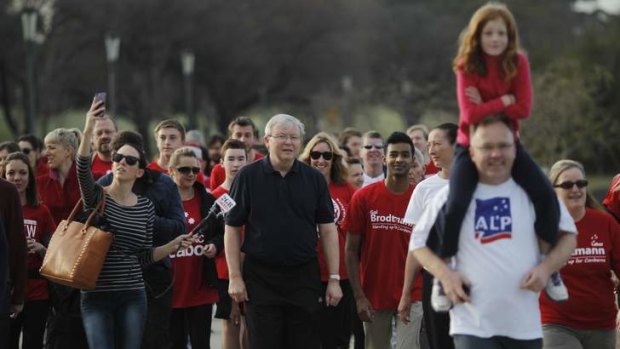 Red army ... Kevin Rudd and his supporters walk around Lake Burley Griffin two days before the September 7 election.