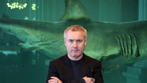Squeezing &#8230; artist Damien Hirst with his work, <em>The Immortal</em>.