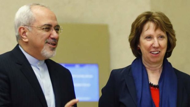 EU foreign policy chief Catherine Ashton (right) arrives with Iranian Foreign Minister Mohammad Javad Zarif for talks in Geneva.