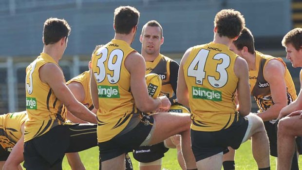 Centre of attention: Jake King has his say at Tiger training.