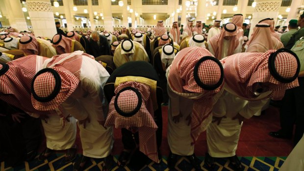Diplomats and the royal family of Saudi Arabia pray at the Turki bin Abdulla mosque in Riyadh.