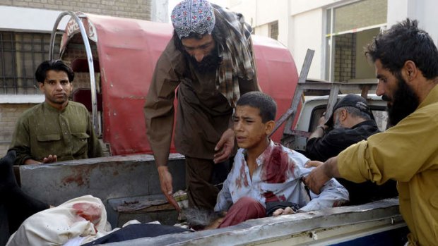An injured boy is taken to a hospital in Quetta following the attack on the mosque.