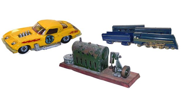 All aboard:(from left) a yellow Corgi Corvette Stingray sold for a bargain $25 this month without the box; this vintage stationary steam engine sold for $150 despite rust and damage; the Spirit of Progress train sold for $400, double the upper estimate.