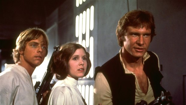 Classic ... Mark Hamill, left, Carrie Fisher, and Harrison Ford appear in character in a scene from the 1977 film <i>Star Wars</i>.  
