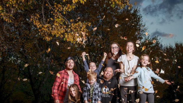 Canberra mum Fiona Lester says she has learnt to not take life too seriously and have more fun with her children. She is pictured with husband James and some of their large brood Tom Riley, Merinda Lester, Taylem Riley, Eddie Lester Olivia Lester and Matilda Lester. 