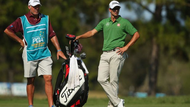 Formidable team: Caddie Steve Williams and Adam Scott at Royal Pines on Friday.