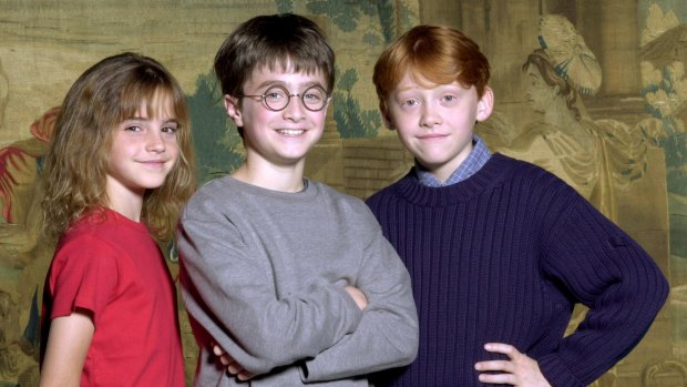 Daniel Radcliffe (C) has been named as the young actor who will play Harry Potter, in the upcoming film adaptation of the popular books by J.K Rowling with newcomers Rupert Grint (R) and Emma Watson taking on the roles of Ron and Hermione, Harry?s best friends at Hogwarts, Warner Bros.  Pictures announced August 21, 2000.  Radcliffe, Grint and Watson are seen in this undated publicity photograph from Warner Bros.    REUTERS/Warner Bros.