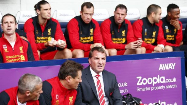 Liverpool's Manager Brendan Rodgers sits on the bench before their match against West Bromwich Albion.