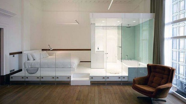 Thanks to glass walls (or no walls at all), the bathroom is no longer a refuge in a shared living space.