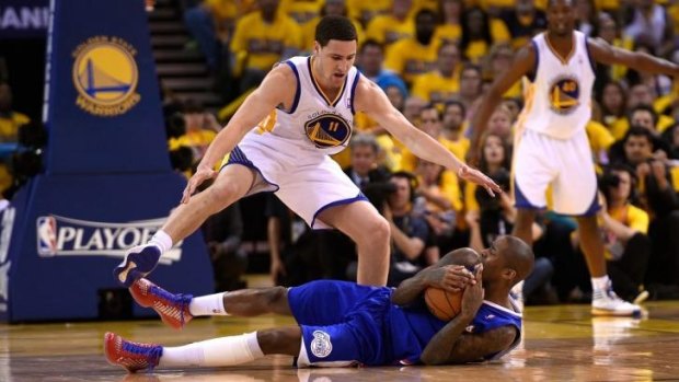 Hovering: Klay Thompson guards Jamal Crawford during a Warriors-Clippers playoff game last season.