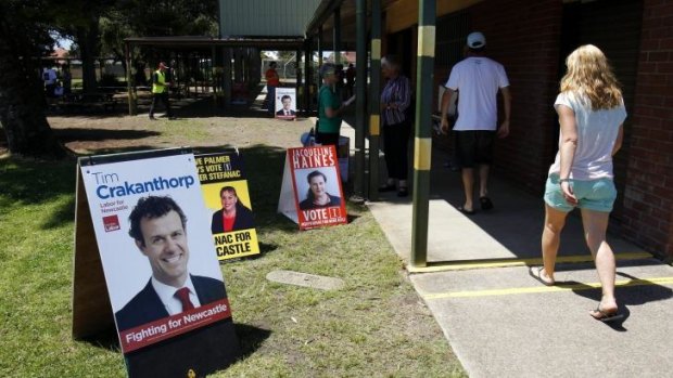 Decision time: Voters arrive at Stockton Public School to vote in the Newcastle byelection.