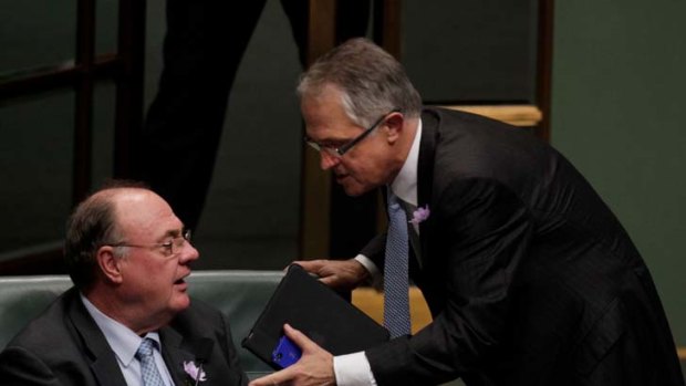 My point is ... Malcolm Turnbull has a  word with the opposition Whip Warren Entsch during question time in Canberra yesterday.