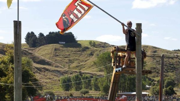 Flags go up at the Mangatainoka Rugby Ground.