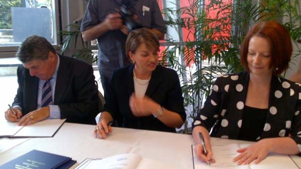 Signing off on the deal ... Moreton Bay mayor Allan Sutherland, Premier Anna Bligh and Prime Minister Julia Gillard.