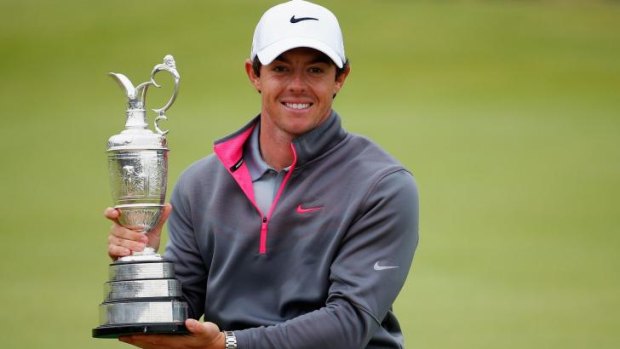 Rory McIlroy, of Northern Ireland, holds the Claret Jug after his two-stroke victory at the Open Championship at Royal Liverpool.