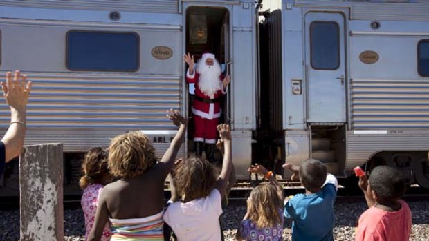 Cross our heart ... Santa's a hit with children in Watson.