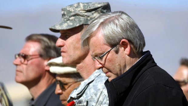 A minute’s silence ... Kevin Rudd, the US General Stanley McChrystal, and the Defence Minister, John Faulkner, in Tarin Kowt.