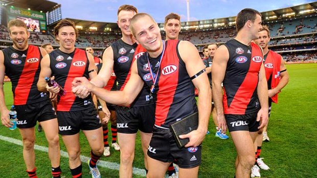 Anzac medallist David Zaharakis joins his Essendon teammates after their win against Collingwood on Thursday.