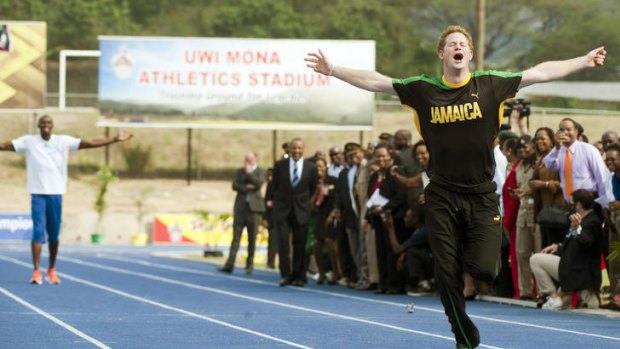 Winner ... Prince Harry leaves Usain Bolt for dead.