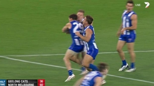 Brent Harvey and Joel Selwood clash during the semi-final on Friday.