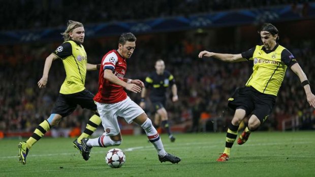 Magician: New signing Mesut Ozil can mesmerise with the ball at his feet, but Arsenal still lack a midfield general in the mould of Roy Keane or Steven Gerrard.
