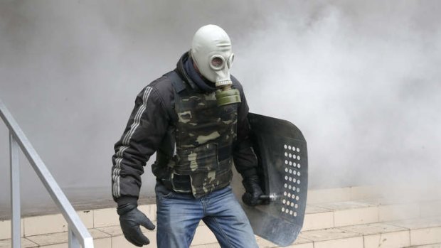 A Pro-Russian activist stands during the mass storming of a police station in Horlivka.